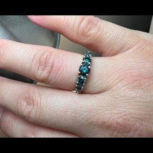 Item: Ladies 10k White Gold Blue Diamond Stone Band Ring